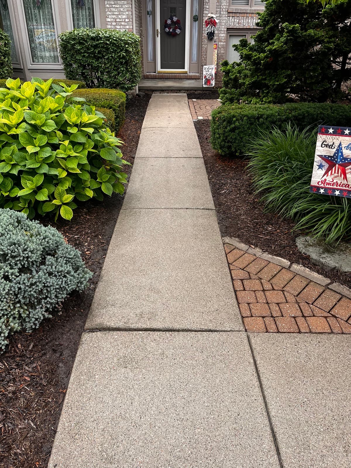 Clean walkway after pressure washing