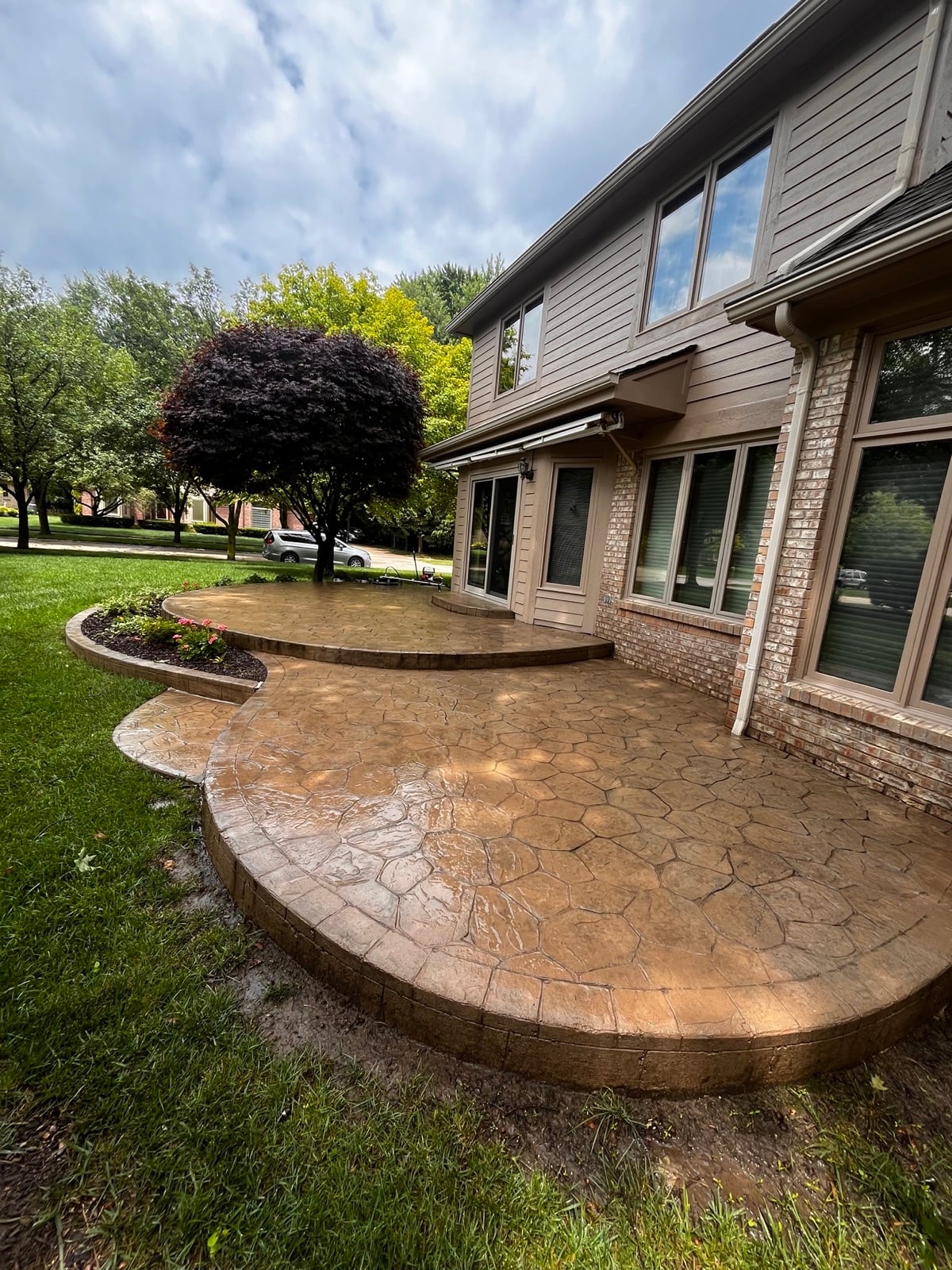 Clean stamped concrete patio after surface cleaning