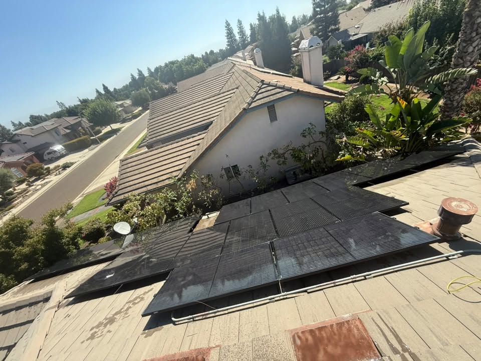 Solar panel cleaning on a residential rooftop