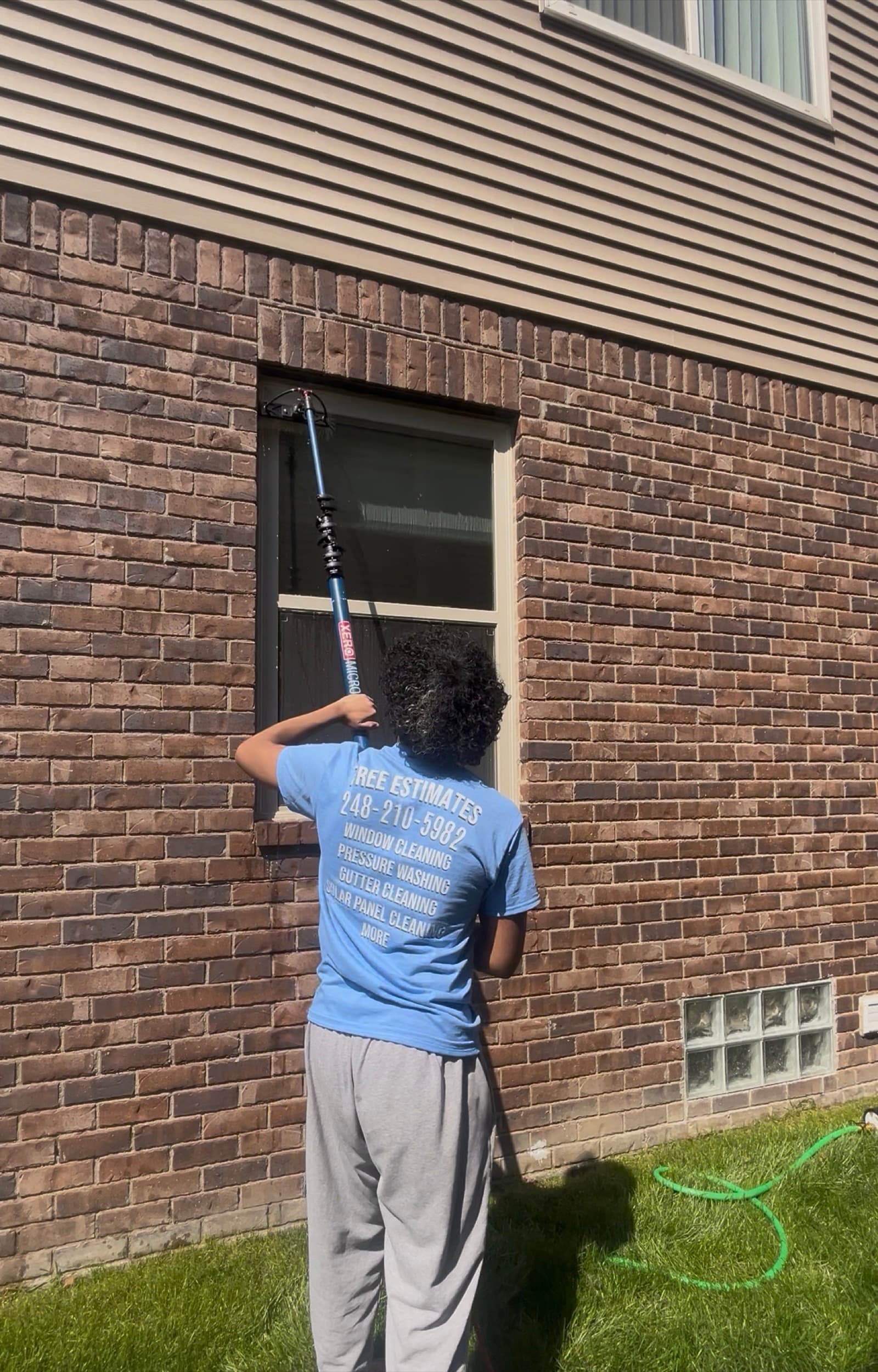 GQ crew cleaning second-story windows